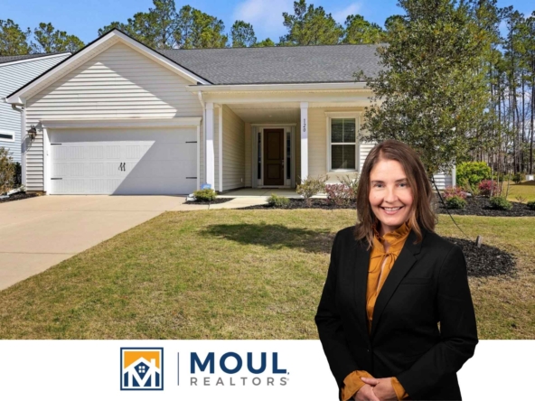 120 Carolina Oaks - agent in front of property