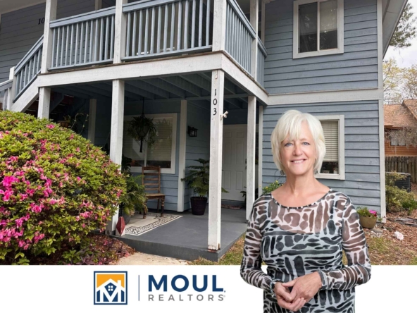 Agent in front of property