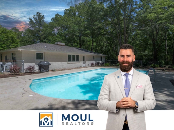 1124 May River Rd - Agent in front of pool on property