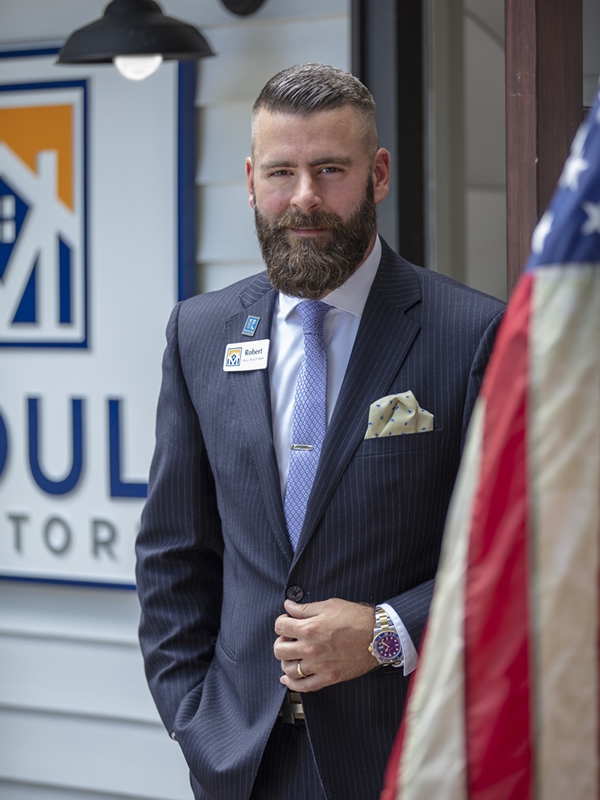 Photo Robert Moul in Front of Moul, REALTORS Office